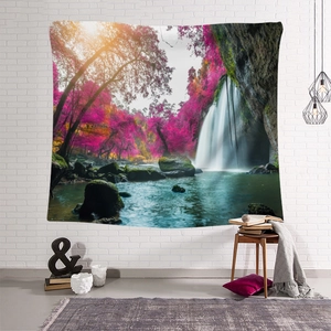 Detail of bohemian nature tapestry featuring a pink forest waterfall on a white brick wall