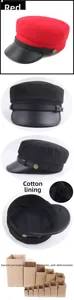Detail view of cotton lining and leather brim on red and black flat top navy cap