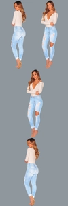 Detail view of high-waist ripped light blue skinny jeans with distressed knee accents