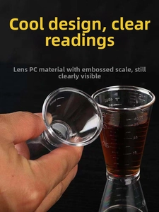 Close-up of clear PC resin double jigger with precise scale marks for cocktail measuring