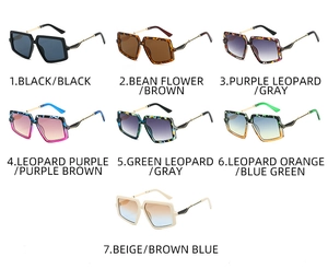 Macro display of seven trendy irregular oversized square sunglasses in assorted frame colors