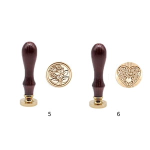 Wax sealing stamp set with rose and heart patterns, featuring brass head and wooden handle