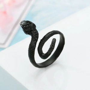 Close-up of a matte black snake ring with detailed scales and adjustable open design