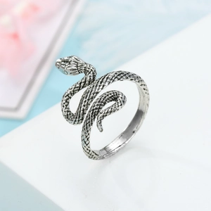 Detail of vintage silver snake ring showing intricate scales and antique finish texture