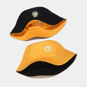 Double-sided daisy embroidered cotton bucket hat in black and yellow colors