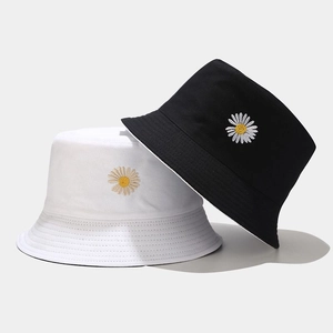 Close-up of dual daisy embroidery on high-quality black and white cotton bucket hats