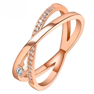 Macro shot of rose gold double-layer criss-cross ring with micro-pave cubic zirconia