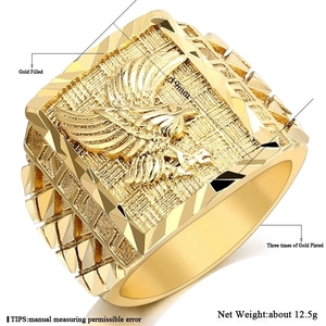 Macro side view of 19mm gold plated square ring featuring detailed eagle relief pattern
