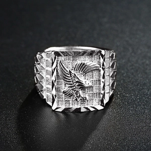 Silver eagle relief ring for men with vintage engraved wings and geometric metal patterns