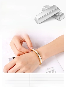 Close-up of 8mm gold titanium bracelet featuring elegant white shell inlay and sleek finish