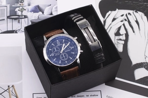 Business gift set featuring a blue dial watch and black bracelet in a textured box