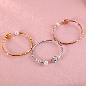 Three open-heart titanium steel bracelets with pearls and lucky evil eye charms