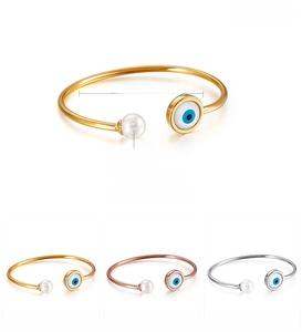 Detail of stainless steel evil eye open bangle with pearl, showing dimensions and 6g weight