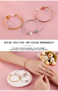Detailed close-up of open pearl bracelets in gold, silver and rose gold finishes