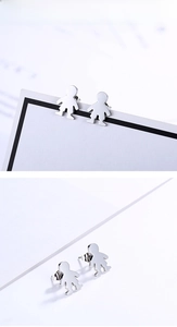 Polished stainless steel boy-shaped stud earrings showing a smooth mirror-like finish