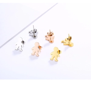 Detailed view of polished stainless steel boy studs in silver, gold, and rose gold colors