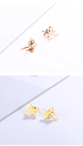 Detailed view of dragonfly stud earrings in rose gold and bright gold polished finish
