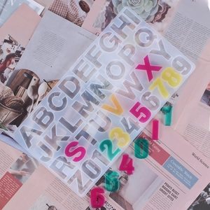 Detailed view of silicone mold for DIY resin alphabet letters and colorful 3D numbers