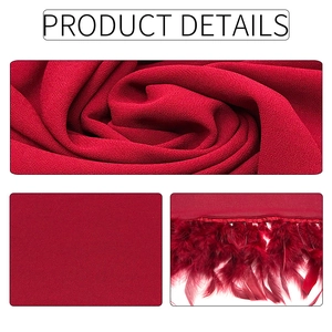Detalle de la textura de gasa de color rojo vino y flecos de plumas delicados