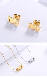 Detail view of gold and silver stainless steel jewelry set with I Heart U design