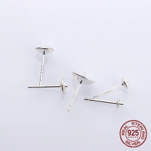 Close-up of S925 sterling silver earring post pins with pearl cup connectors