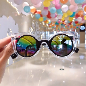 Close-up of children's round sunglasses with rainbow lenses and dual-tone frames