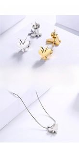 Detail of 18K gold plated butterfly necklace and earrings set in gold and silver finish
