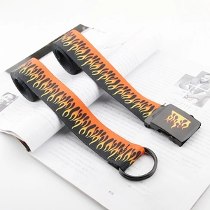 Detail of street-style canvas belt with red flame print and black metal buckle
