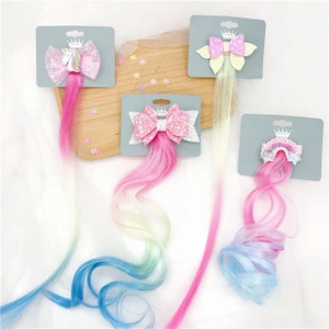 Close-up of colorful glitter bow hair clips with rainbow gradient curly wig extensions