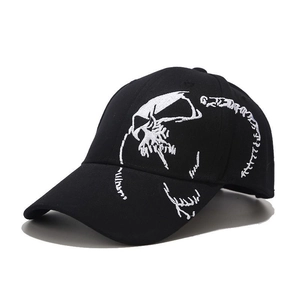 Detailed white spinal skull embroidery on a black streetwear cotton baseball cap
