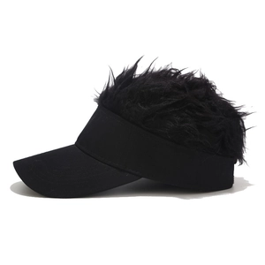 Detail view of the black visor cap with short curly synthetic hair on white background