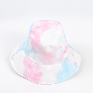 Detailed close-up of pink and blue tie-dye pattern on cotton bucket hat fabric