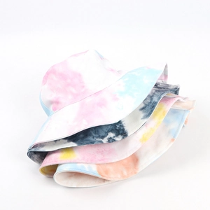 Detailed stack of colorful tie-dye bucket hats in vibrant cotton fabric shades