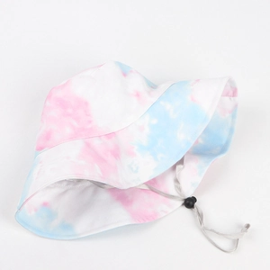 Detail of colorful tie-dye bucket hat featuring an adjustable grey drawstring with cord lock