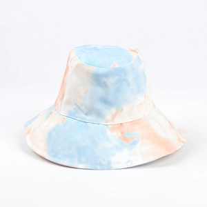 Detail of colorful tie-dye bucket hat featuring vibrant blue and orange watercolor patterns