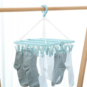 Blue foldable plastic drying rack with 32 clips for hanging socks and baby clothes