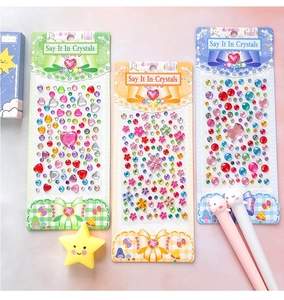 Three packs of colorful acrylic crystal stickers in heart and star shapes for DIY crafts