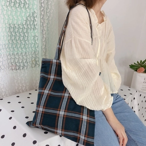 Plaid canvas tote bag with classic check pattern for daily commute and casual use