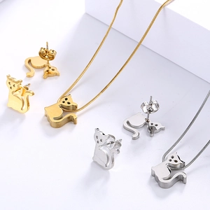 Minimalist cat jewelry set with gold and silver necklaces and matching stud earrings