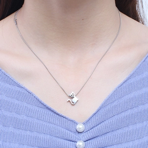 Minimalist silver cat pendant necklace on model with stainless steel chain link