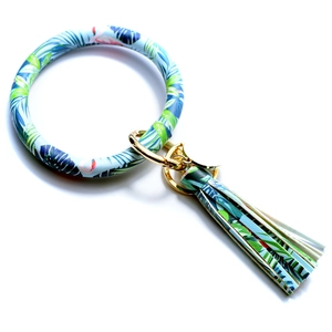 Detailed view of light blue tropical leaf print PU leather wristlet with tassel keychain