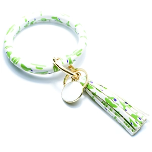 Detail of PU leather wristlet keychain with green cactus print and gold metal ring