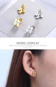 Detail of corrosion resistant gold and silver couple silhouette stud earrings on model
