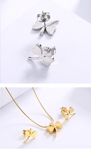Detail view of four-leaf clover jewelry sets in silver and gold metallic finishes