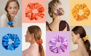 Macro detail of satin scrunchies showing glossy silk texture in blue and orange