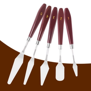 Detailed set of five different stainless steel palette knives with wooden handles
