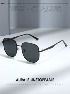 Detail of black oversized metal frame sunglasses with sleek temples and gradient lenses