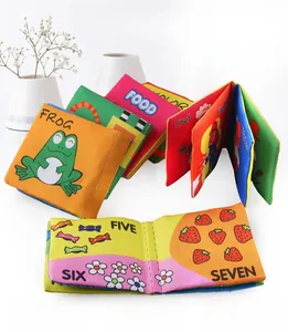Macro view of baby soft books set showing colorful animal and number learning patterns