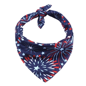 Detailed fabric texture of dog bandana with red and white fireworks on navy blue