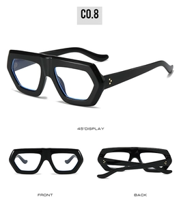 Detail view of hexagonal black frames with iconic gold triple-dot rivets and clear lenses